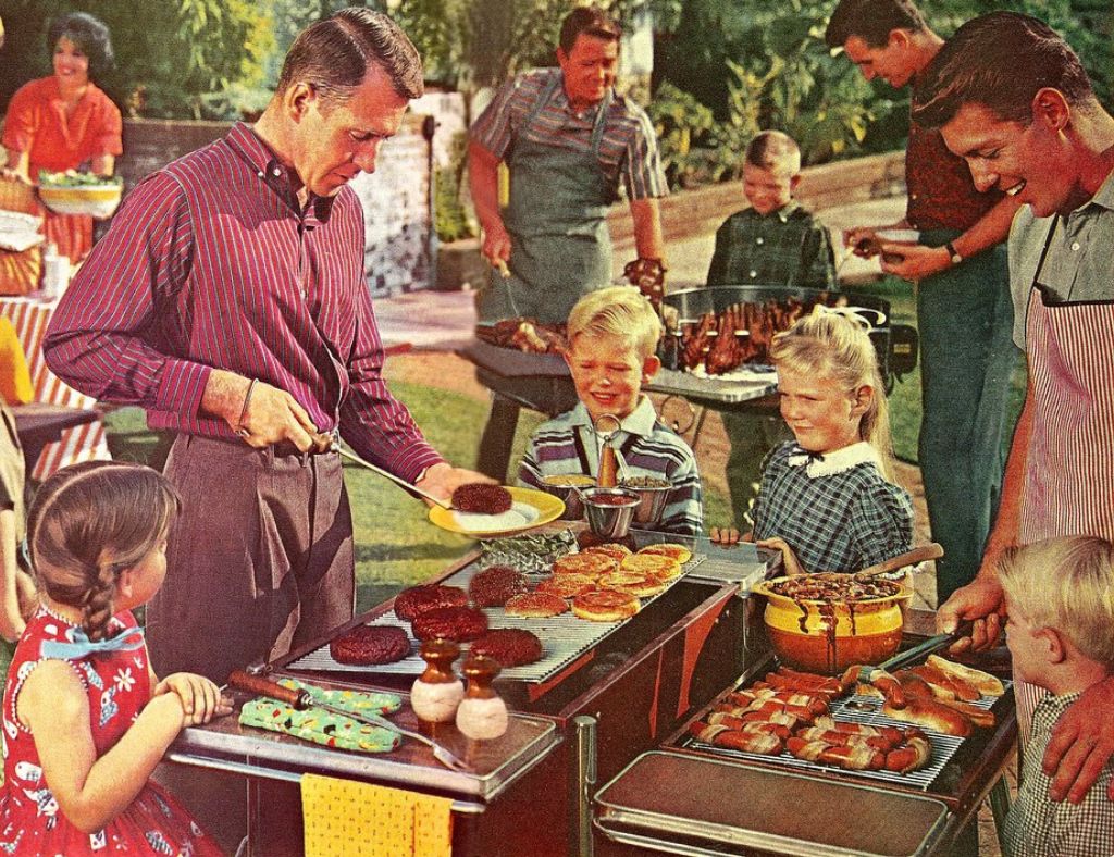 Vintage-style neighborhood barbecue with adults grilling hamburgers and hot dogs while children gather around during a family-friendly Cedar Ridge Estates summer social.